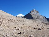 04 Mount Kailash South Face And Nandi From Confluence Of Two Rivers Early Morning On Mount Kailash Inner Kora Nandi Parikrama After leaving Ashtapad (07:30, 5171m), the sun finally comes over the ridge (08:00) and warms us as we reach the confluence of the two dry rivers coming from both sides of Nandi. The full south face of Mount Kailash is still partially hidden by the intervening ridge.